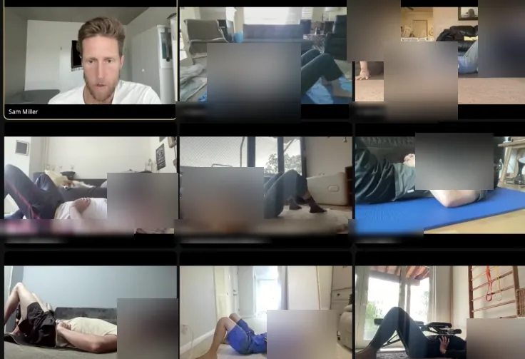 Sam and members practicing together on a live Zoom call, on the floor from home